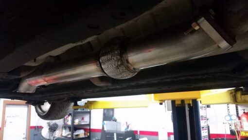 Mid car dump exhaust